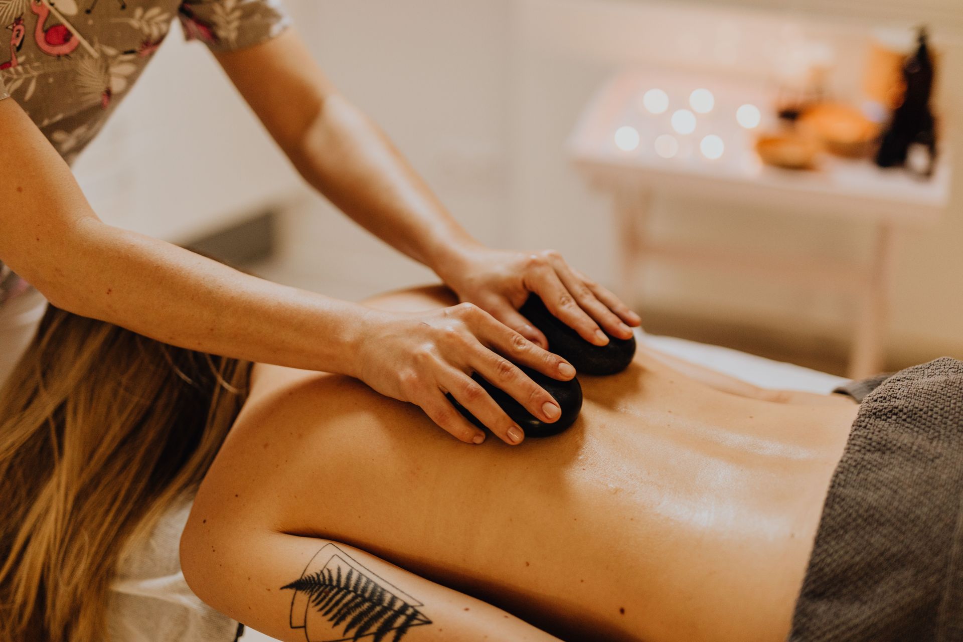 A calming massage therapy session with hot stones for relaxation and wellness.